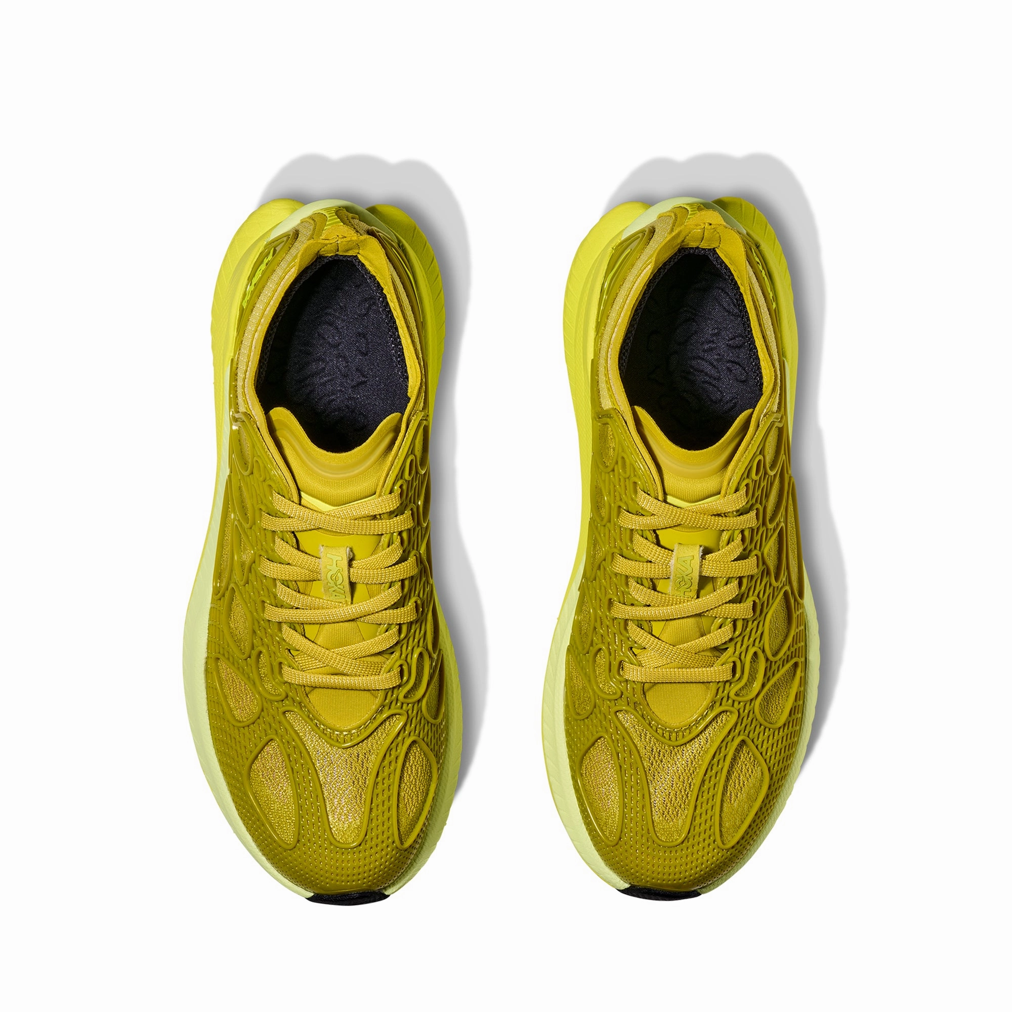 Hoka U Mach X Caged Shoes Engineered Knit running in a gondola station area shoes